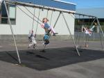 Students play on the swings during recess at the Evergreen Elementary School playground. The playground's equipment is almost 30 years-old.